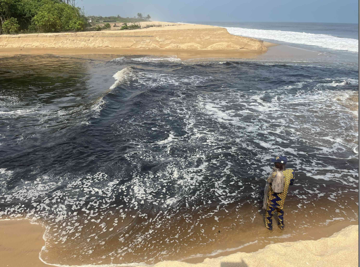 A fisher man captured after an ocean surge that covered a reserved mangrove site in Ibeju-Lekki , Lagos, Nigeria